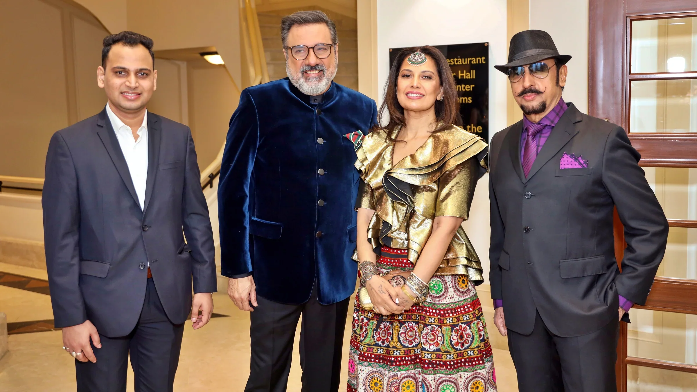 Lithvik Mukesh Sharma with principals on a grand staircase.