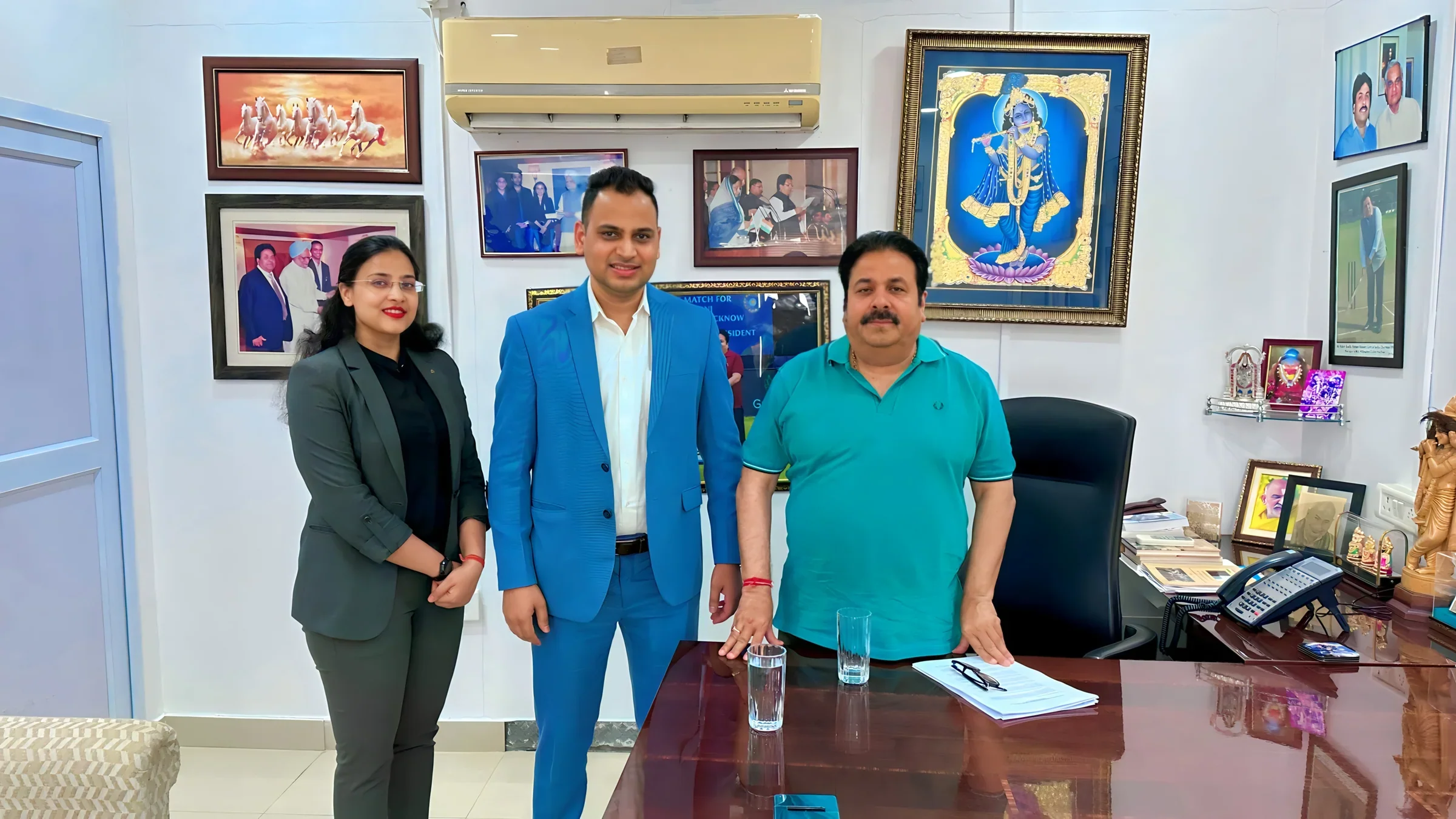 Lithvik Mukesh Sharma in a three-chair office meeting.
