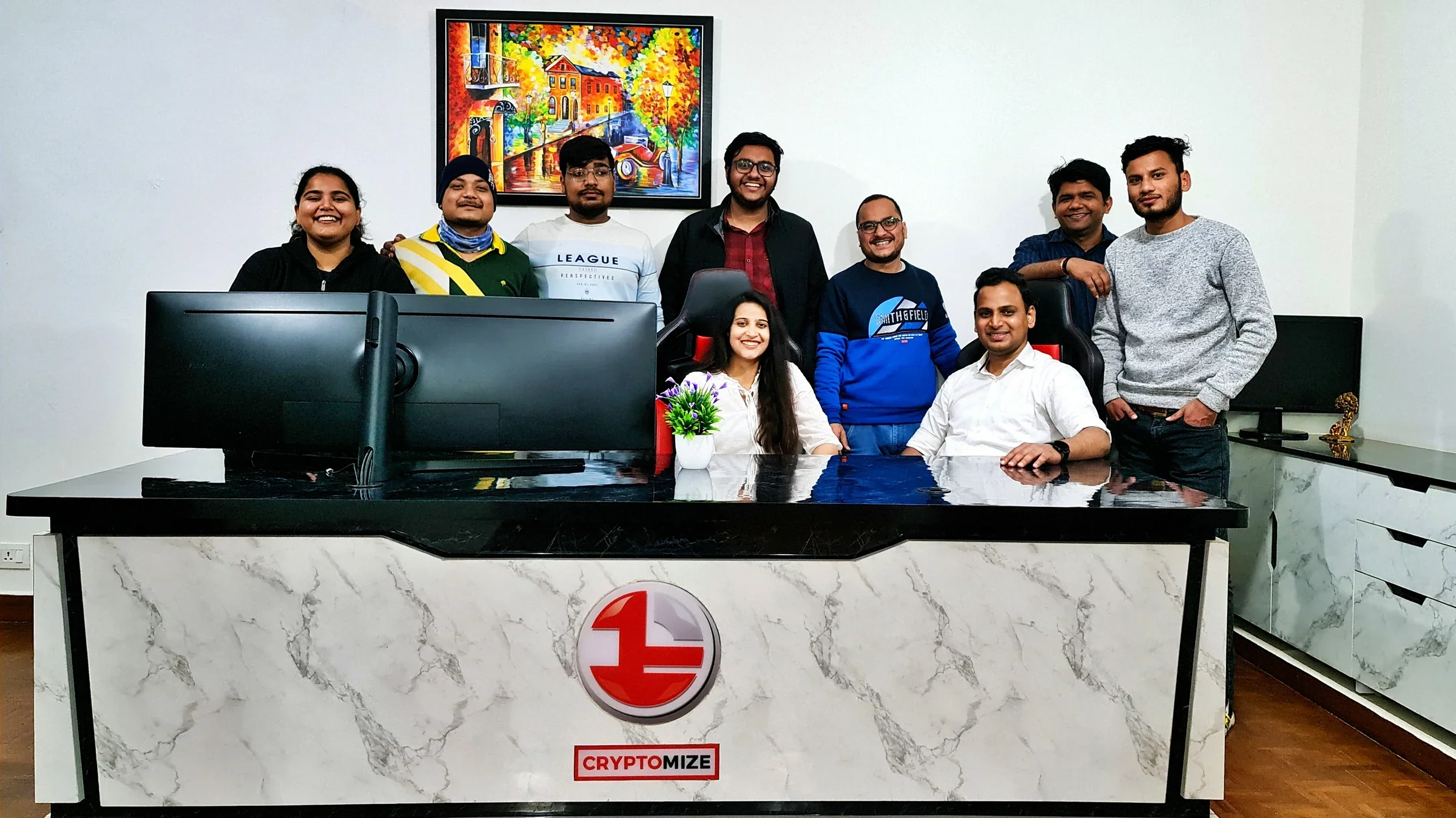Lithvik Mukesh Sharma is photographed with Dr. Jyoti Kush and the CryptoMize customer support team
