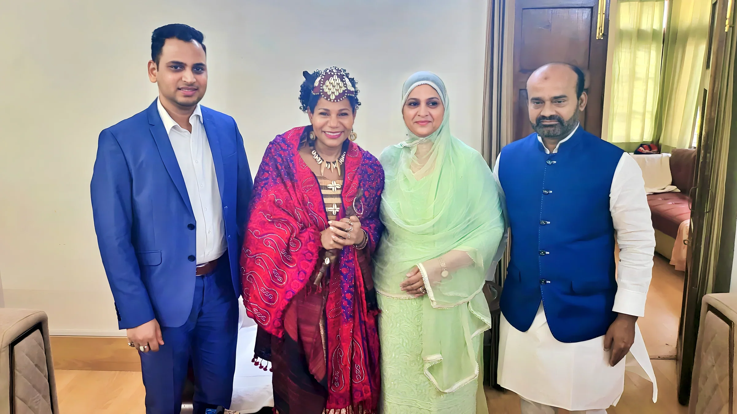 Lithvik Mukesh Sharma is photographed with Queen Diambi and political leaders in the company of guests