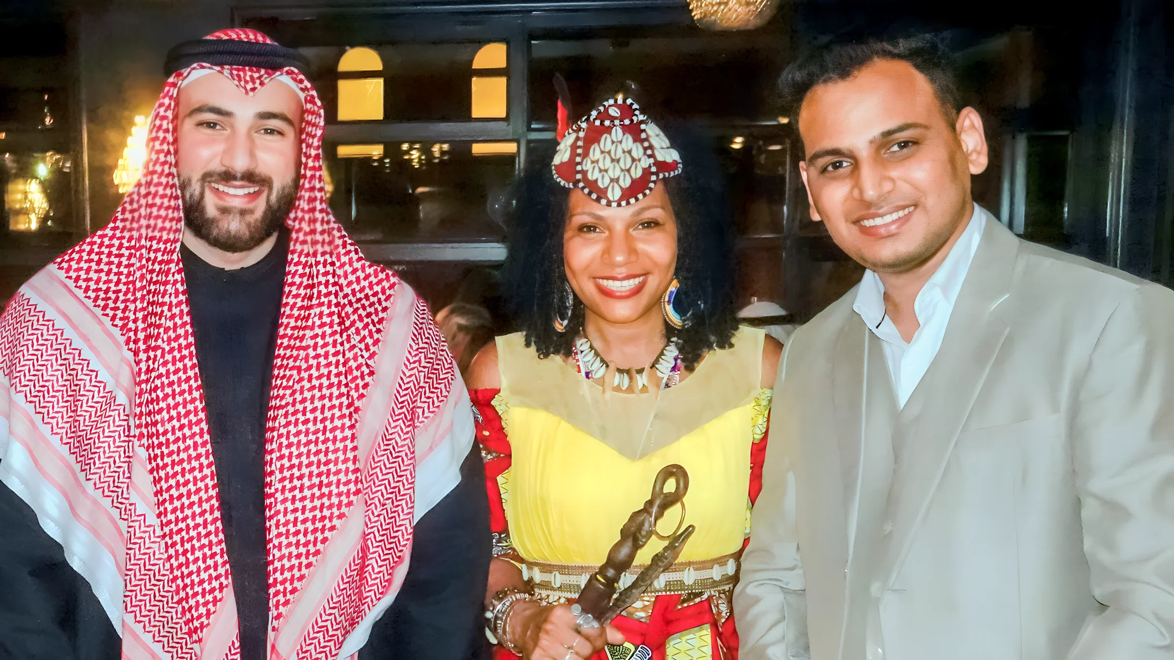 Lithvik Mukesh Sharma is photographed with Queen Diambi and Dr. Bader Abdulmutaleb Ibrahim.