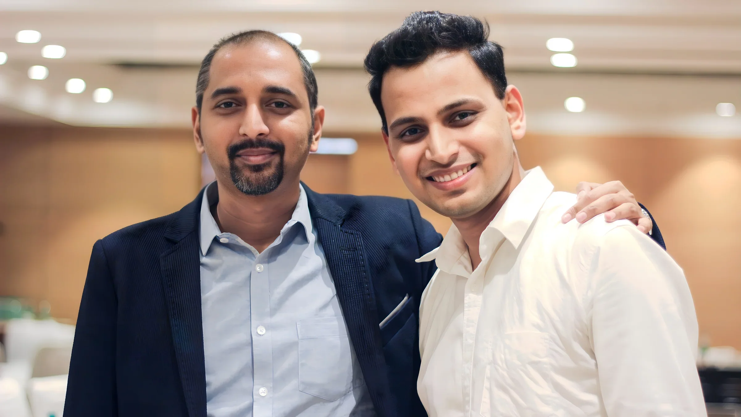 Lithvik Mukesh Sharma is photographed with Rajshekhar Murthy at a business meeting.