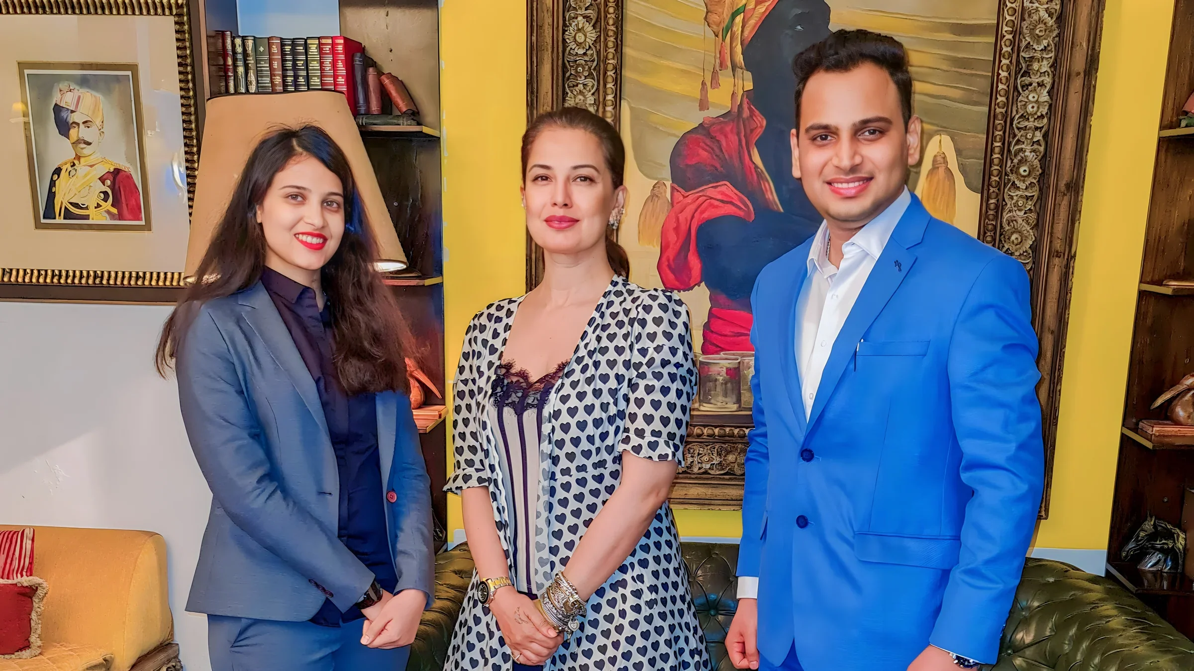 Lithvik Mukesh Sharma is photographed with Dr. Jyoti Kush and Ritu Beri at an indoor reception