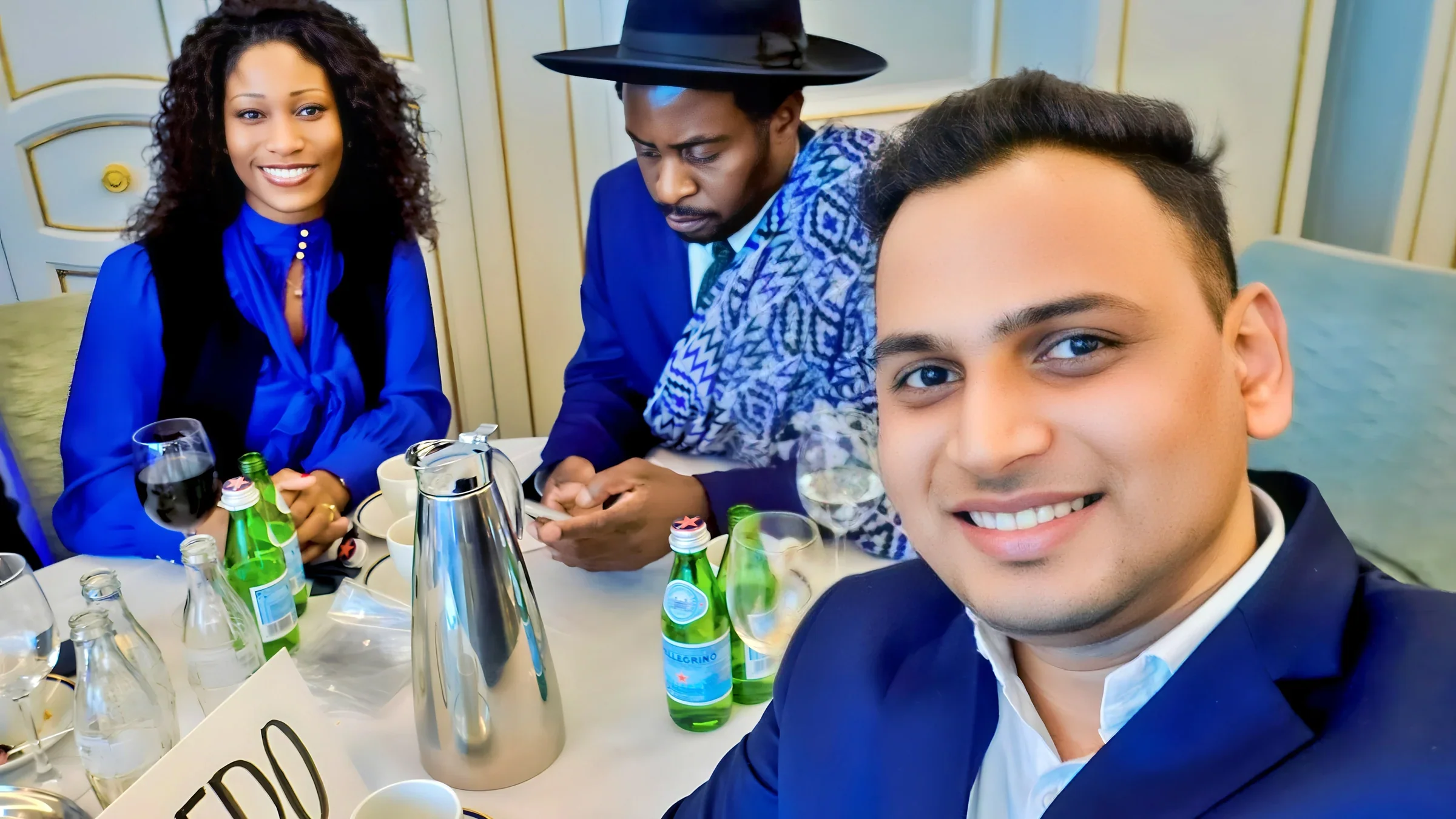 Lithvik Mukesh Sharma is photographed with Dr. Saviour Chishimba and Cinthia Loïs Ta Thomsen (Member of Parliament of the State of the African Diaspora and Founder and Chief Executive of the African Chamber of Commerce Scandinavia (ACCS))