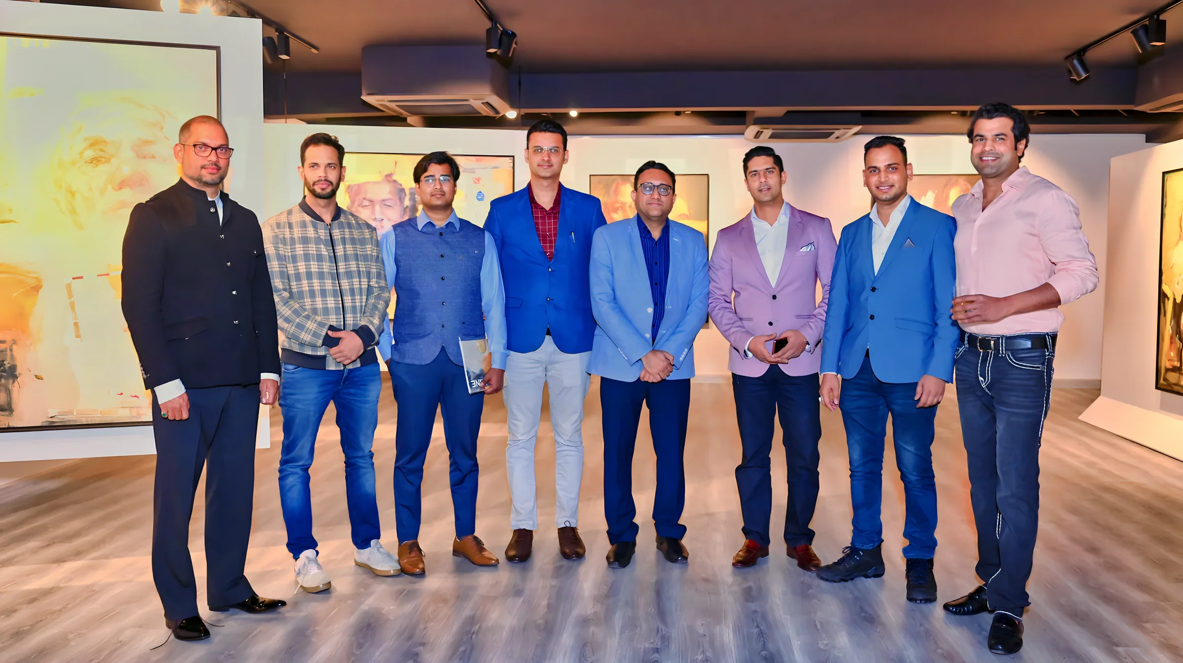 Lithvik Mukesh Sharma is photographed with Subrat Nath, Kapil Madan, Sumer Raj Chadha, Deepak Chaudhary, Gagan Sharma, Dheeraj, and Anirudh at an art event in the evening.