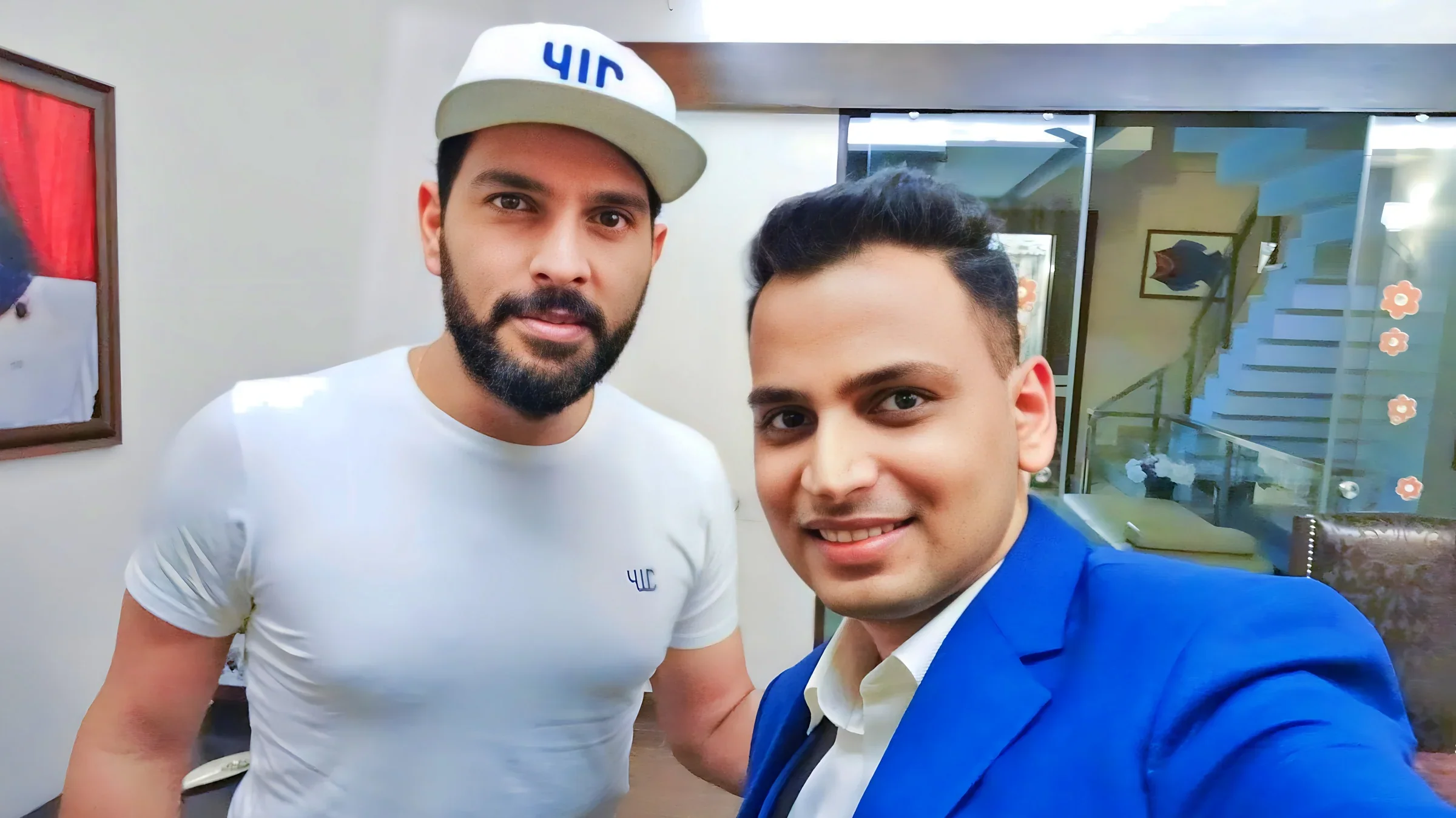 Lithvik Mukesh Sharma is photographed with Yuvraj Singh at a professional engagement.